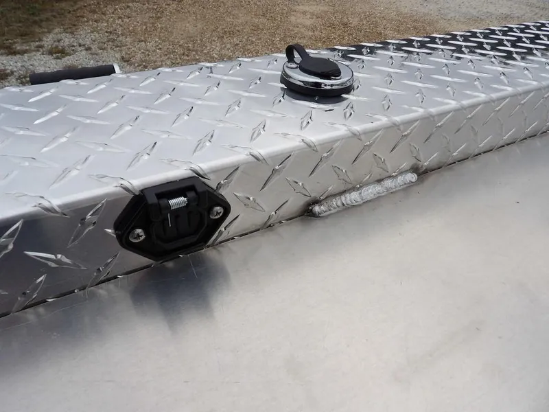 Slide: The Image of Aluminum diamond plate surface on 2025 Blazer 1752 SC boat, featuring a fuel cap and latch. - 28