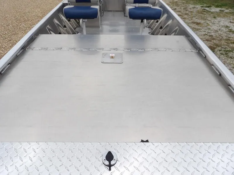 Slide: The Image of 2025 Blazer 1752 SC boat interior with aluminum deck and blue seats. - 29