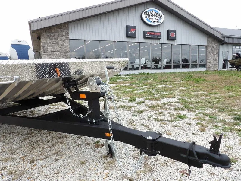 Slide: The Image of 2025 Blazer 1752 SC trailer parked outside a marine service center. - 31