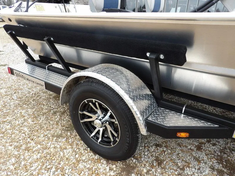 Slide: The Image of 2025 Blazer 1752 SC boat trailer with diamond plate fender and black wheel. - 32