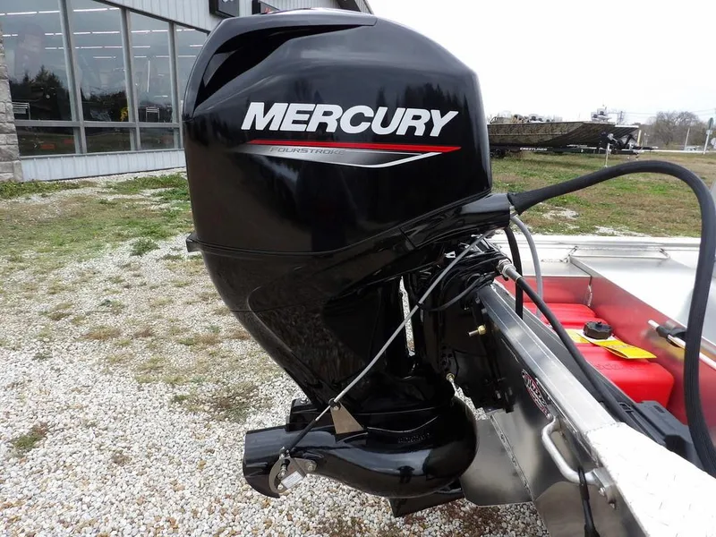 Slide: The Image of 2025 Blazer 1752 SC boat with Mercury outboard motor, parked outdoors. - 35