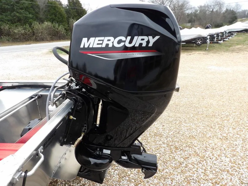 Slide: The Image of 2025 Blazer 1752 SC boat with Mercury outboard motor on gravel surface. - 37