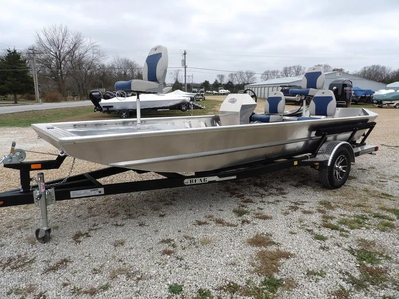 Slide: The Image of 2025 Blazer 1752 SC boat on trailer, parked outdoors on gravel. - 4