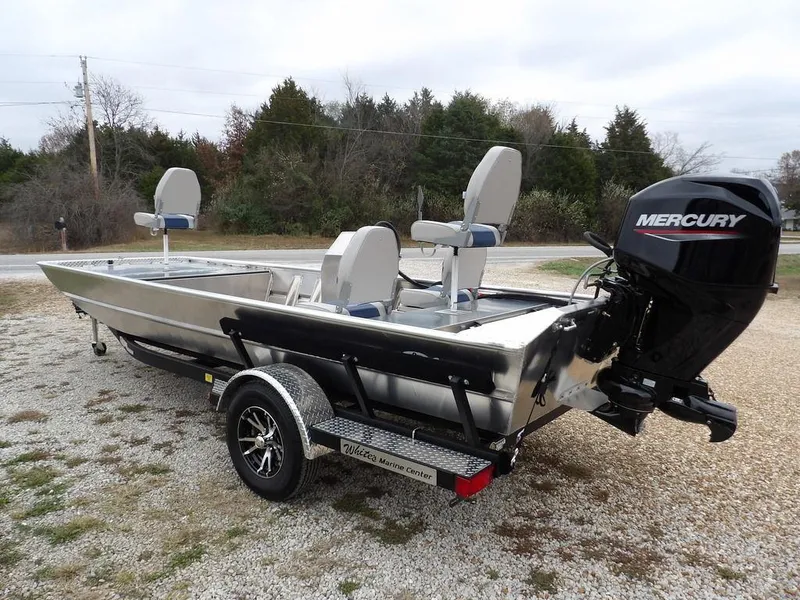 Slide: The Image of 2025 Blazer 1752 SC boat with Mercury engine on a trailer, parked outdoors. - 6