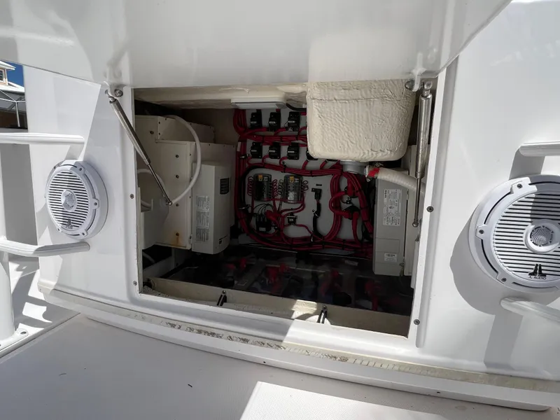 Slide: The Image of Electrical compartment of 2019 Everglades 435 Center Console boat, featuring wiring and components. - 22