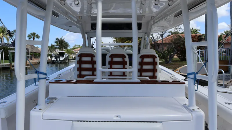 Slide: The Image of 2019 Everglades 435 Center Console boat interior with seating and helm station. - 34