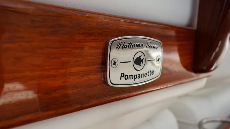 Slide: The Image of Pompanette Platinum Series badge on Everglades 435 Center Console, 2019 model, wooden finish. - 42