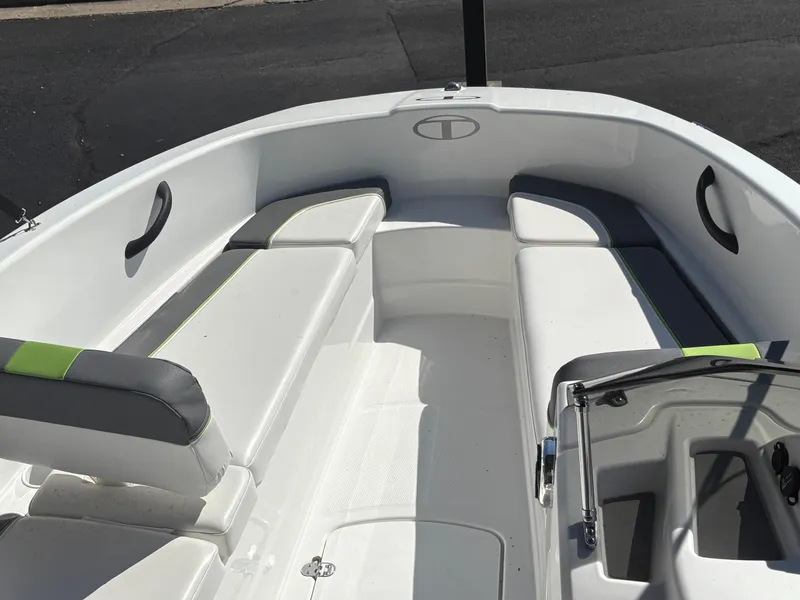 Slide: The Image of 2024 Tahoe T16 boat interior with white seating and modern design. - 13