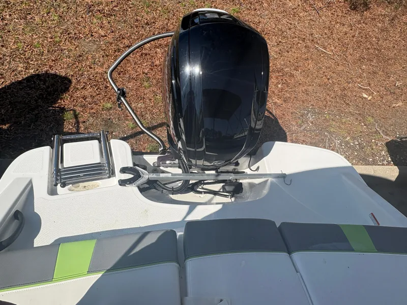 Slide: The Image of 2024 Tahoe T16 boat engine and seating area, featuring sleek design and modern features. - 14