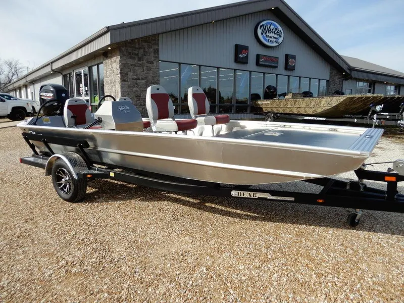The Image of 2025 Blazer 1752 SC boat on trailer outside dealership, featuring sleek design and modern seating. - 1