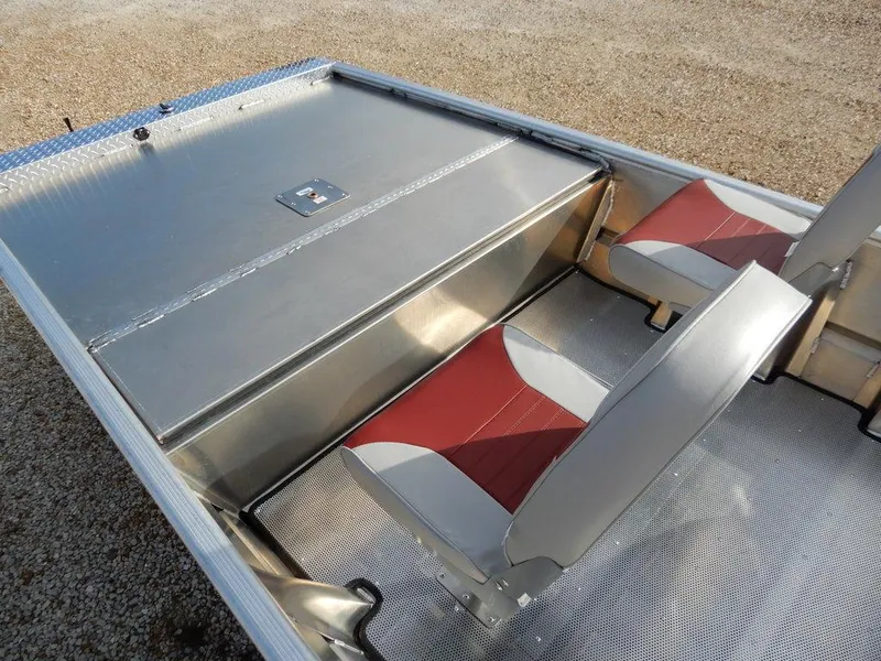 Slide: The Image of 2025 Blazer 1752 SC boat interior with red and white seats and metal storage compartment. - 11