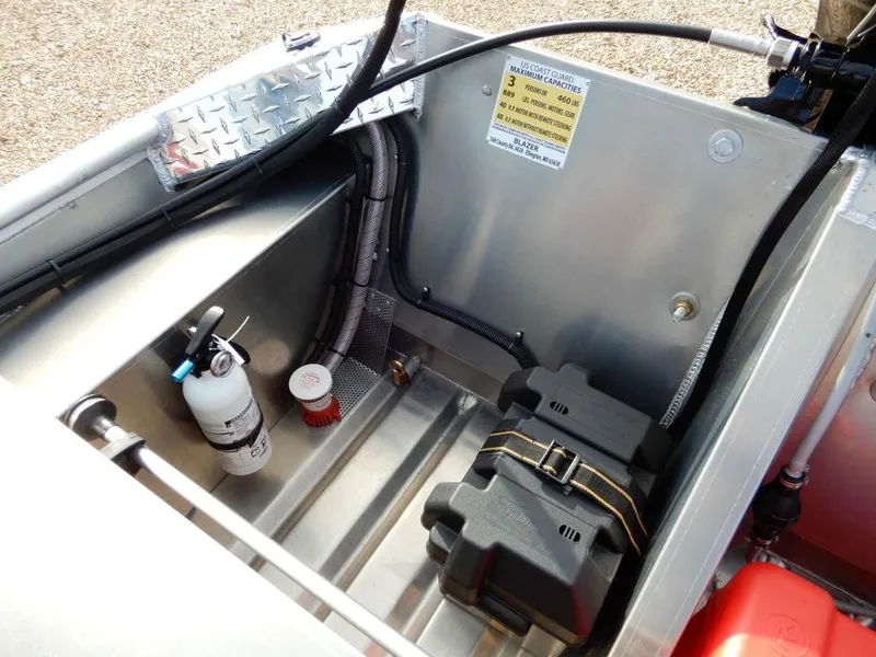 Slide: The Image of 2025 Blazer 1752 SC boat interior showing battery compartment and safety equipment. - 12