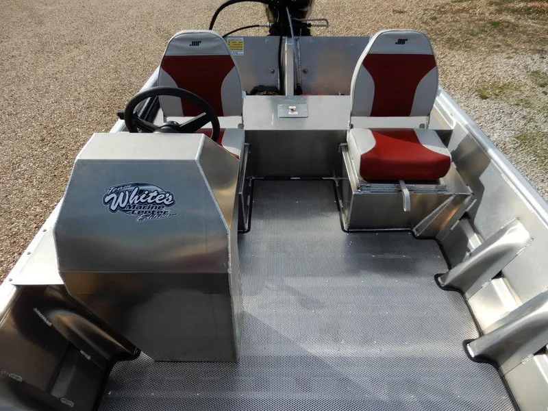 Slide: The Image of 2025 Blazer 1752 SC boat interior with red seats and steering console. - 15