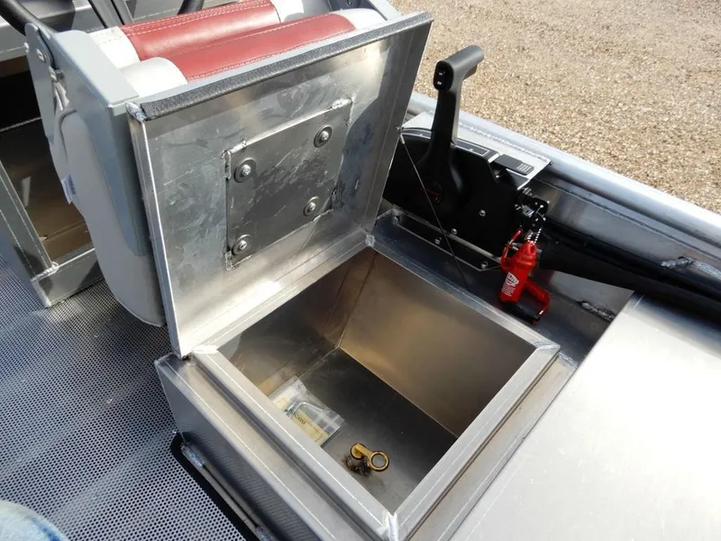 Slide: The Image of Open storage compartment in 2025 Blazer 1752 SC boat, featuring metallic finish and safety equipment. - 19