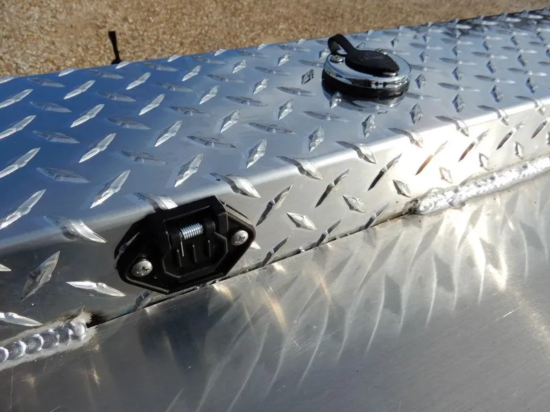 Slide: The Image of 2025 Blazer 1752 SC diamond plate surface with latch and handle detail. - 26