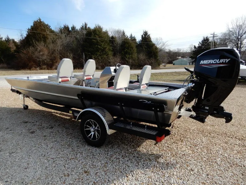Slide: The Image of 2025 Blazer 1752 SC boat with Mercury engine on a trailer, parked outdoors. - 5