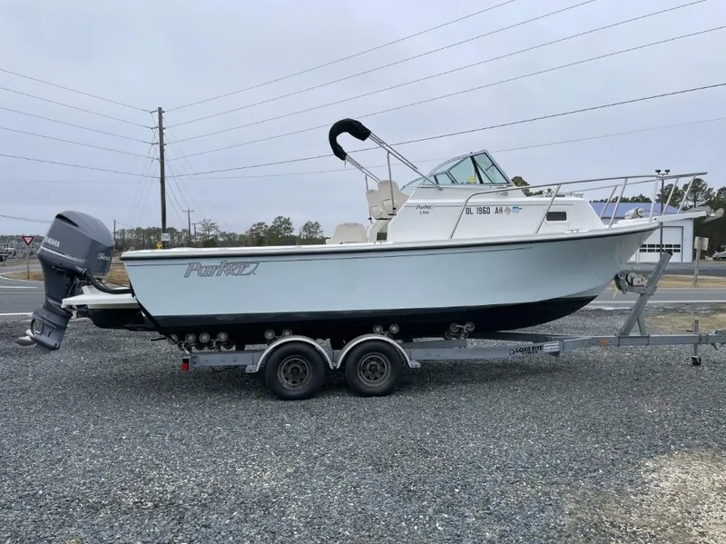 Slide: The Image of 2014 Parker 2310 Walkaround boat on trailer with Yamaha outboard motor. - 1