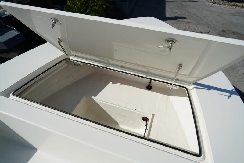 Slide: The Image of Open storage compartment on 2025 Hewes Redfisher 21 boat, showcasing spacious interior. - 18