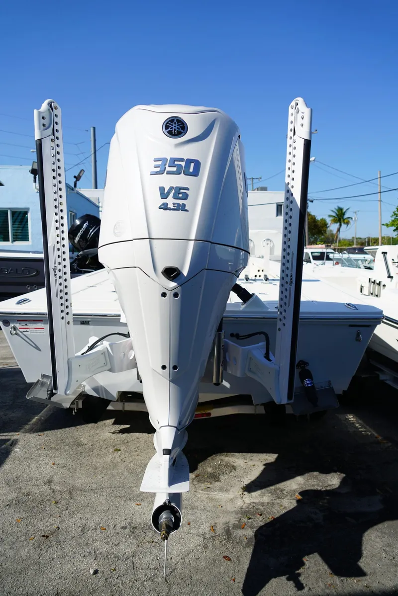 Slide: The Image of 2025 Hewes Redfisher 21 boat with Yamaha 350 V6 engine, displayed outdoors. - 3