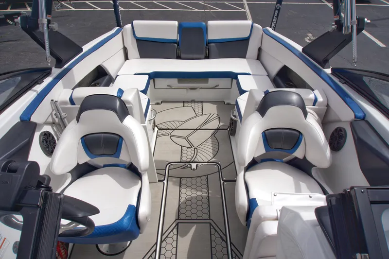 Slide: The Image of Interior of 2020 Scarab 255 ID boat with white and blue seating. - 12