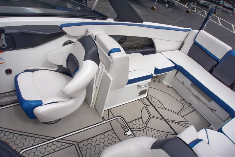 Slide: The Image of Interior of 2020 Scarab 255 ID boat with white and blue seating and modern design. - 13