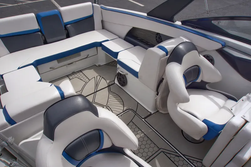 Slide: The Image of 2020 Scarab 255 ID boat interior with white and blue seating, modern design. - 14