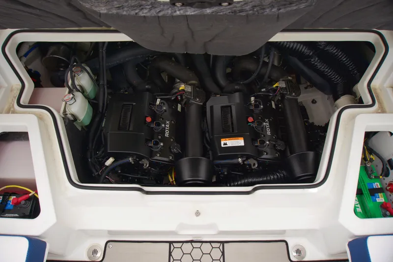 Slide: The Image of Engine compartment of 2020 Scarab 255 ID boat, showcasing dual Rotax engines. - 16