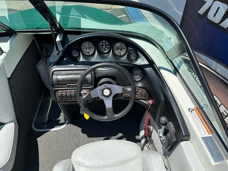 Slide: The Image of 1998 Ski Centurion sport bowrider dashboard with steering wheel and instrument panel. - 13