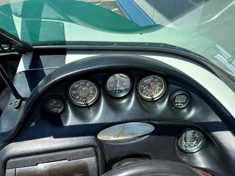 Slide: The Image of 1998 Ski Centurion sport bowrider dashboard with gauges and controls. - 14