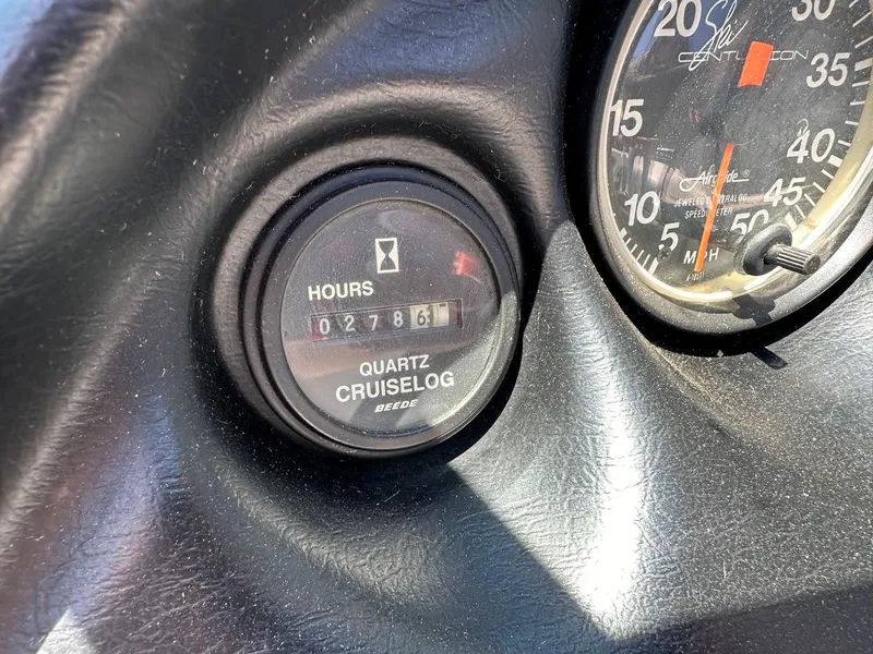 Slide: The Image of 1998 Ski Centurion sport bowrider dashboard with hour meter and speedometer. - 15