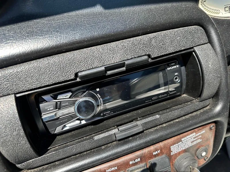 Slide: The Image of 1998 Ski Centurion sport bowrider dashboard with Sony stereo system and control panel. - 17