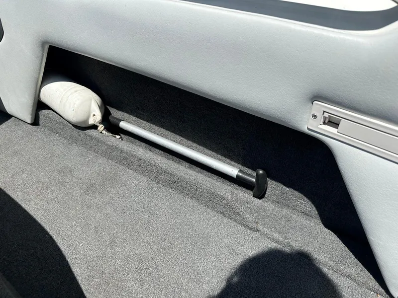 Slide: The Image of Interior of 1998 Ski Centurion sport bowrider with storage compartment and boat fender. - 22