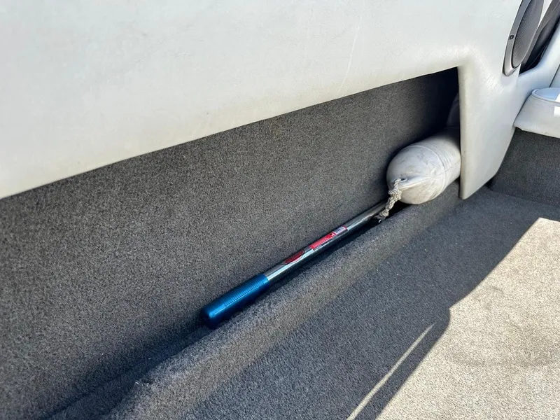 Slide: The Image of Interior of 1998 Ski Centurion sport bowrider with storage compartment and boating equipment. - 24