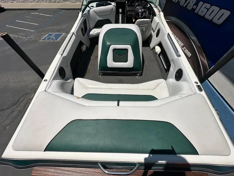 Slide: The Image of 1998 Ski Centurion sport bowrider interior with green and white seating. - 8