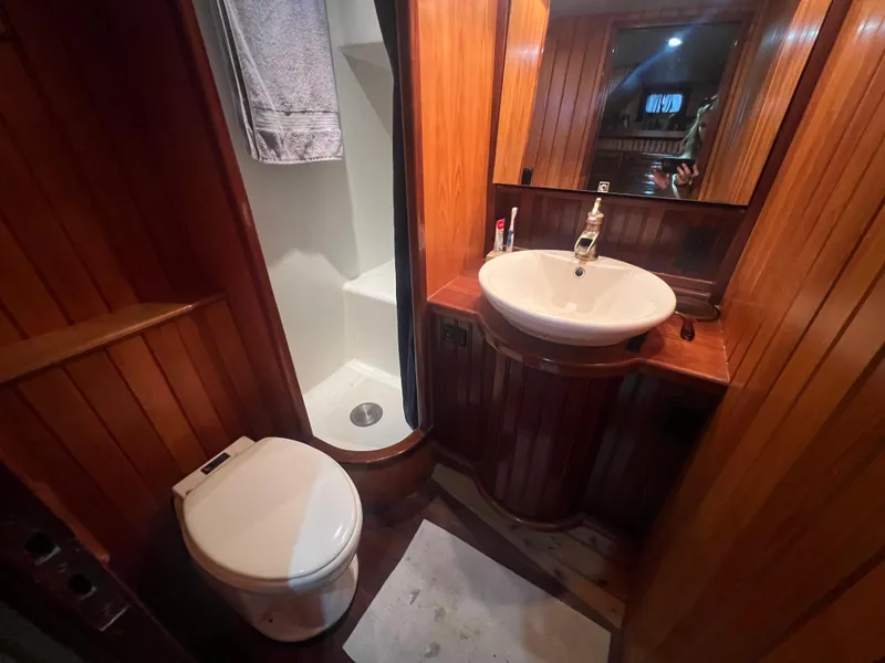 Slide: The Image of Wood-paneled boat bathroom with sink, toilet, and shower; Romsdal Fjord 1965 model. - 18
