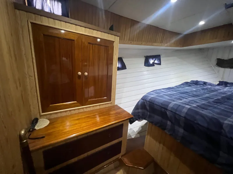 Slide: The Image of Cozy cabin interior of 1965 Romsdal Fjord boat with wooden furniture and bed. - 20