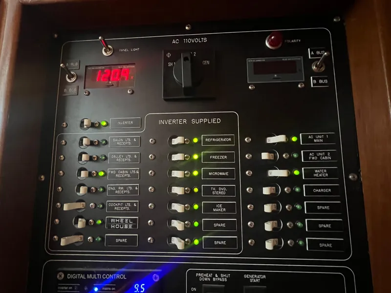 Slide: The Image of Electrical control panel on a 1965 Romsdal Fjord boat, featuring switches and digital display. - 23