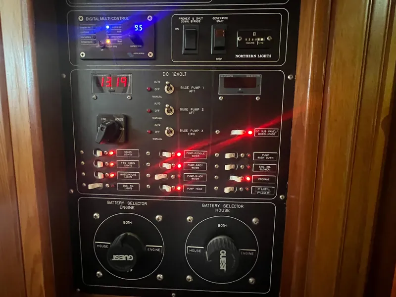 Slide: The Image of Control panel of a 1965 Romsdal Fjord boat with switches and battery selectors. - 24