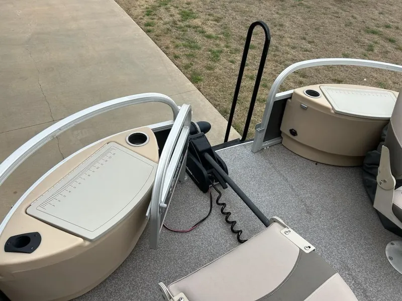 Slide: The Image of 2015 Sun Tracker fb22X3 boat interior with seating and storage compartments. - 11