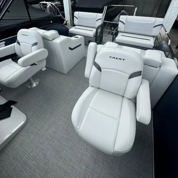Slide: The Image of 2024 Crest Classic DLX 220 SLRC boat interior with luxurious seating and modern design. - 4