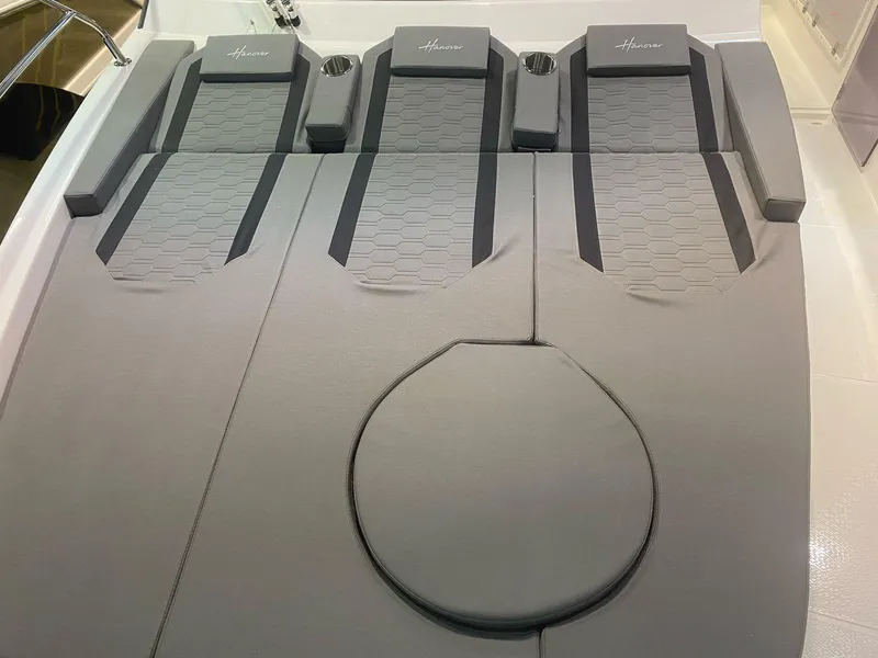 Slide: The Image of 2025 Hanover 387 boat interior with sleek gray seating and modern design. - 5