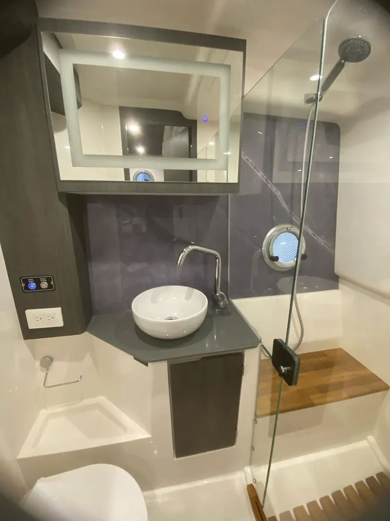 Slide: The Image of Modern bathroom in 2025 Hanover 387 with sleek fixtures and glass shower. - 6