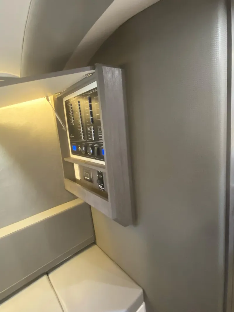 Slide: The Image of Control panel inside Hanover 387, 2025 model, with modern design and illuminated switches. - 7