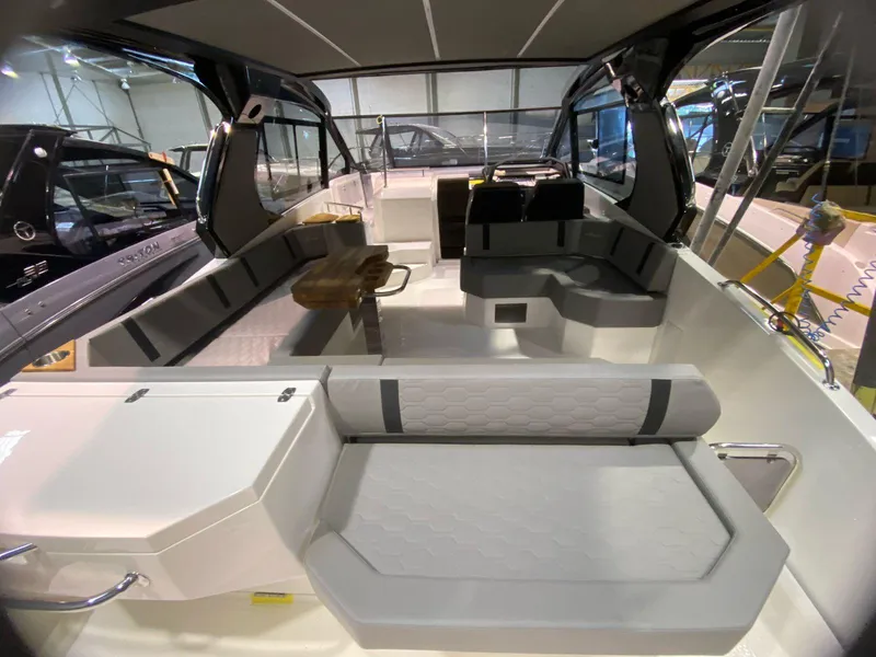 Slide: The Image of Interior of 2025 Hanover 387 boat with modern seating and sleek design. - 9