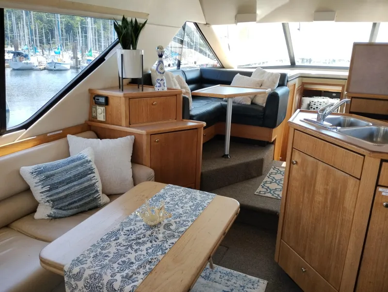 Slide: The Image of Luxurious interior of 1997 Bayliner 3988 Motor Yacht with cozy seating and elegant decor. - 12