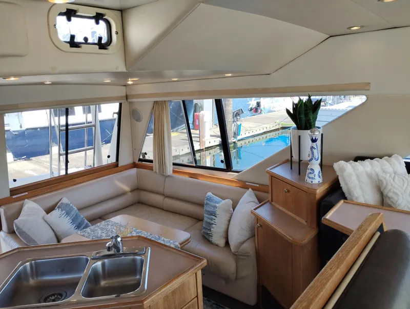 Slide: The Image of Luxurious interior of 1997 Bayliner 3988 Motor Yacht with plush seating and modern decor. - 13