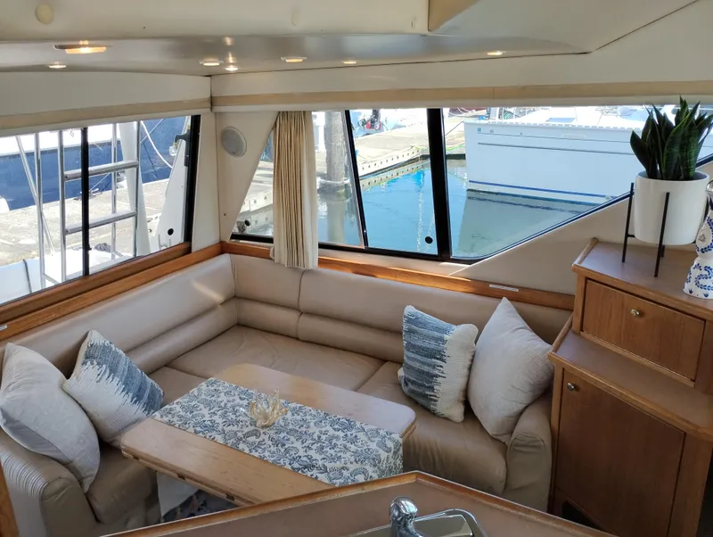 Slide: The Image of Luxurious interior of 1997 Bayliner 3988 Motor Yacht with plush seating and elegant decor. - 14