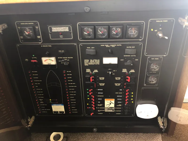 Slide: The Image of Control panel of a 1997 Bayliner 3988 Motor Yacht with various gauges and switches. - 16