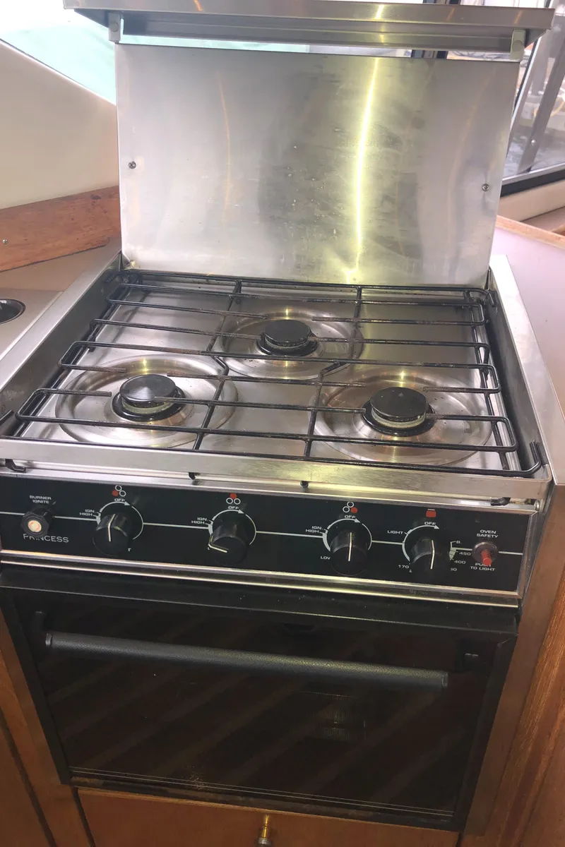 Slide: The Image of Gas stove and oven in 1997 Bayliner 3988 Motor Yacht kitchen area. - 22