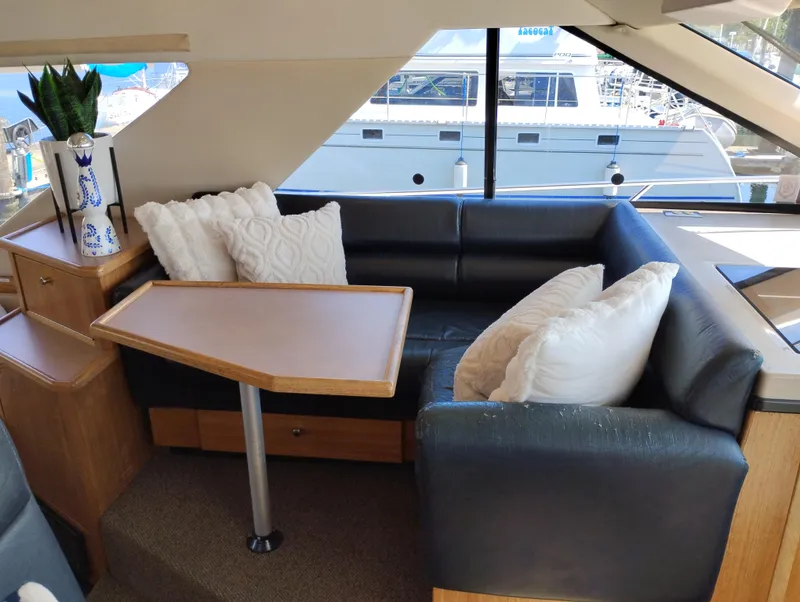 Slide: The Image of Luxurious interior of 1997 Bayliner 3988 Motor Yacht with plush seating and elegant decor. - 23